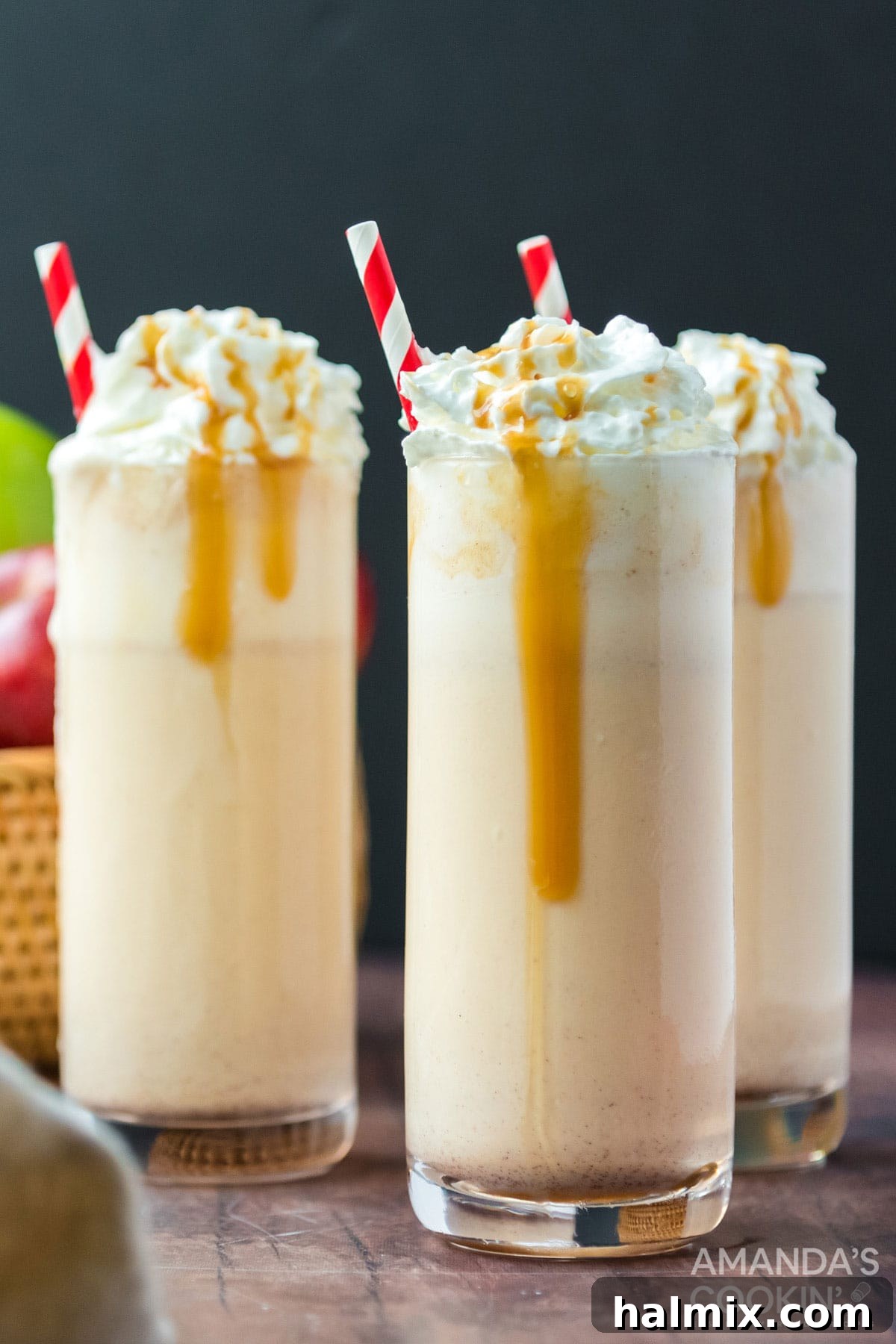 Only 3 ingredients for this delicious, fall inspired apple cider milkshake. So easy to make and a an amazing way to wrap up summer. Three beautifully presented apple cider milkshakes with festive garnishes