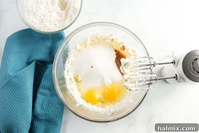 A bowl filled with butter, shortening, and sugar, ready to be creamed.