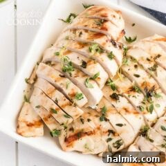 sliced grilled chicken breasts on a platter