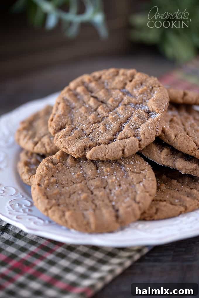 Nutella Swirl Peanut Butter Cookies 4 Several Nutella Peanut Butter Cookies cooling on a wire rack, showcasing their uniform size and inviting texture before being fully enjoyed.