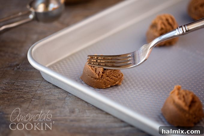 Nutella Swirl Peanut Butter Cookies 6 A detailed image showing a cookie scoop perfectly portioning dough onto an ungreased baking sheet, illustrating the recommended spacing for even baking.