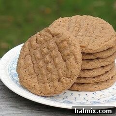 Nutella Swirl Peanut Butter Cookies 8 A close up photo of a stack of Nutella peanut butter cookies resting on a plate.