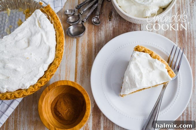 A close-up of a generous slice of pumpkin pie, revealing its smooth, creamy filling and flaky crust, artfully plated and ready to be enjoyed.