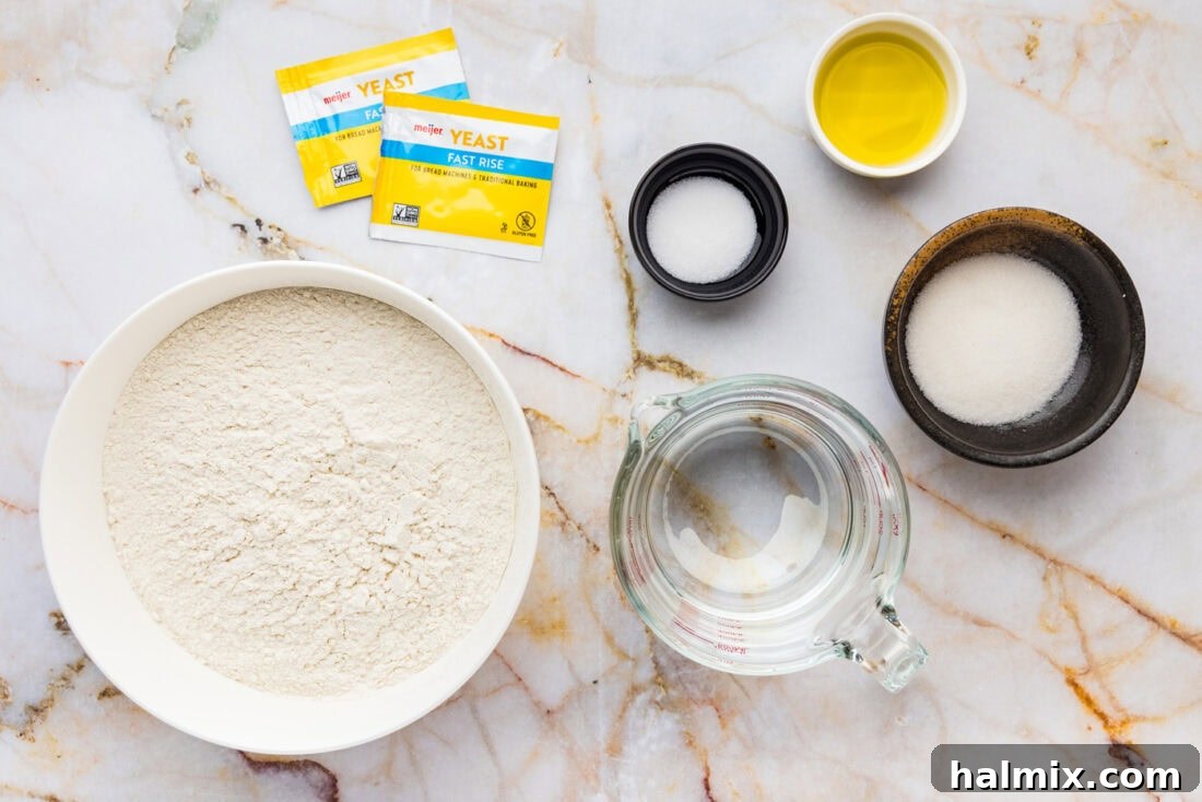 The 60-Minute Loaf 4 Collection of ingredients for One Hour Bread, including flour, sugar, salt, yeast, olive oil, water, and an egg