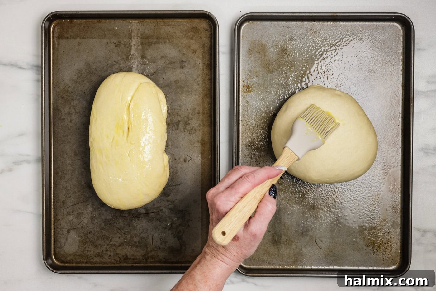The 60-Minute Loaf 8 Brushing egg wash over bread dough on baking sheets before scoring