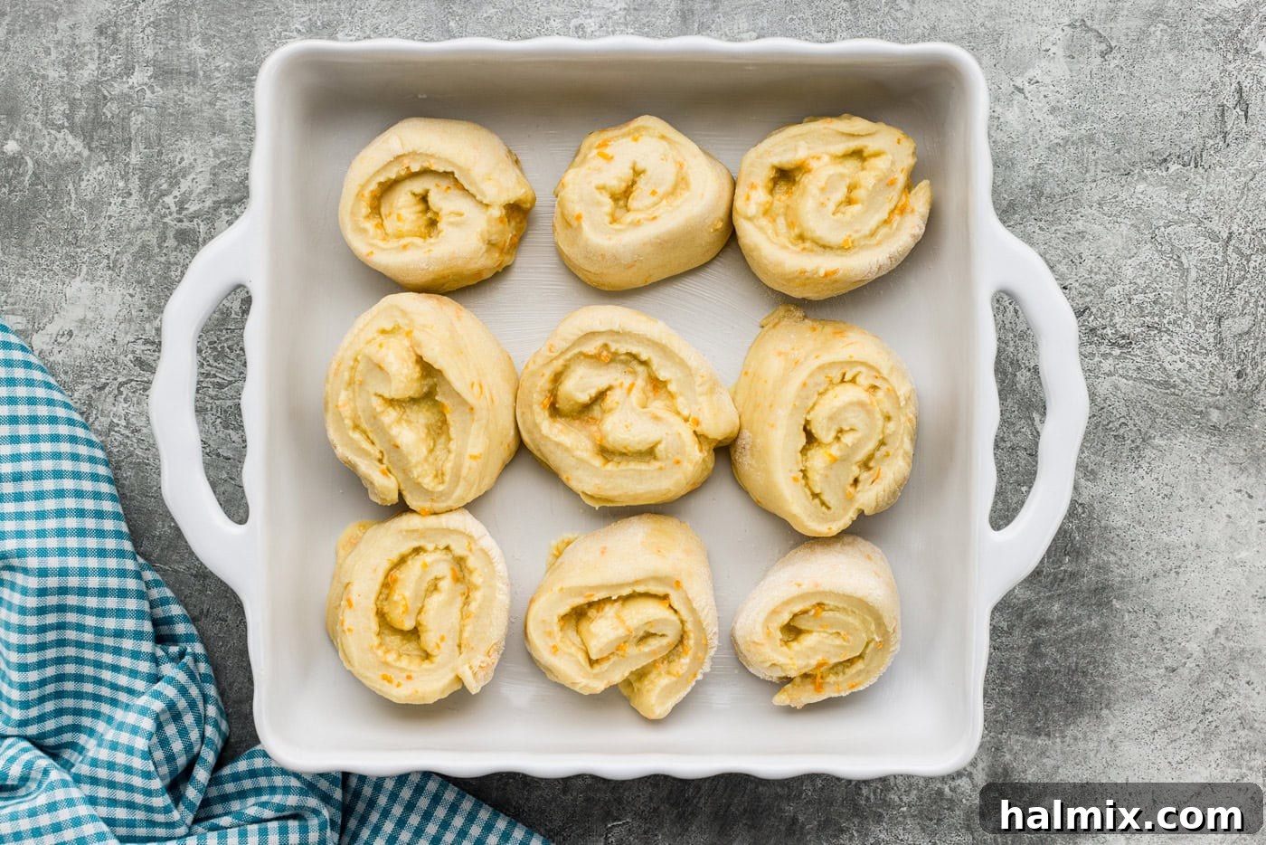 Orange roll dough spirals in a baking dish