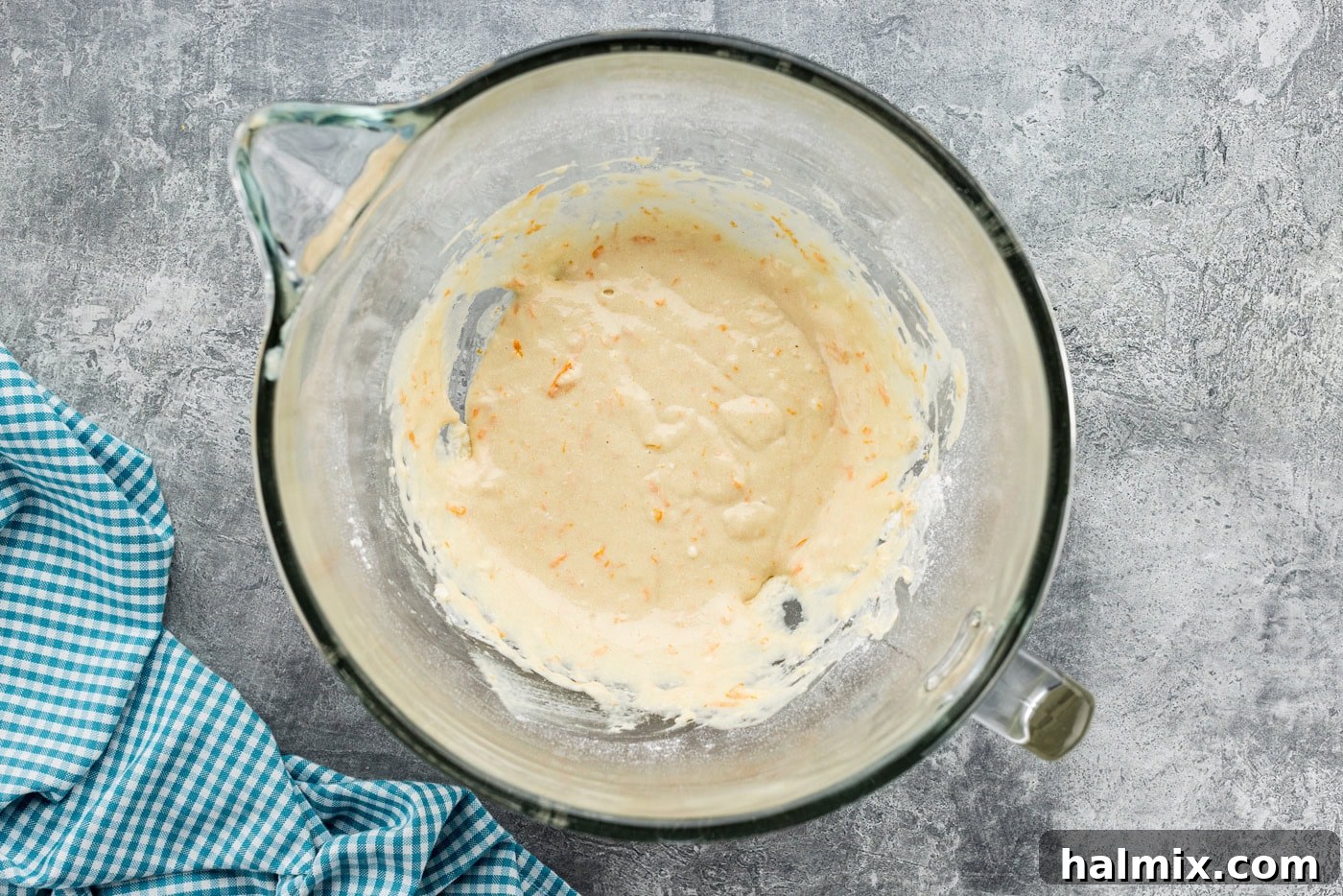 Orange roll batter in a stand mixer bowl