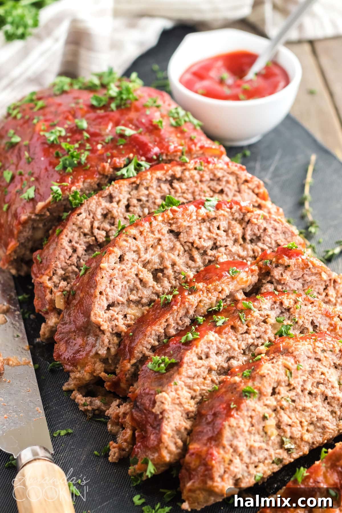 Sliced meatloaf with a rich, savory glaze, ready to serve