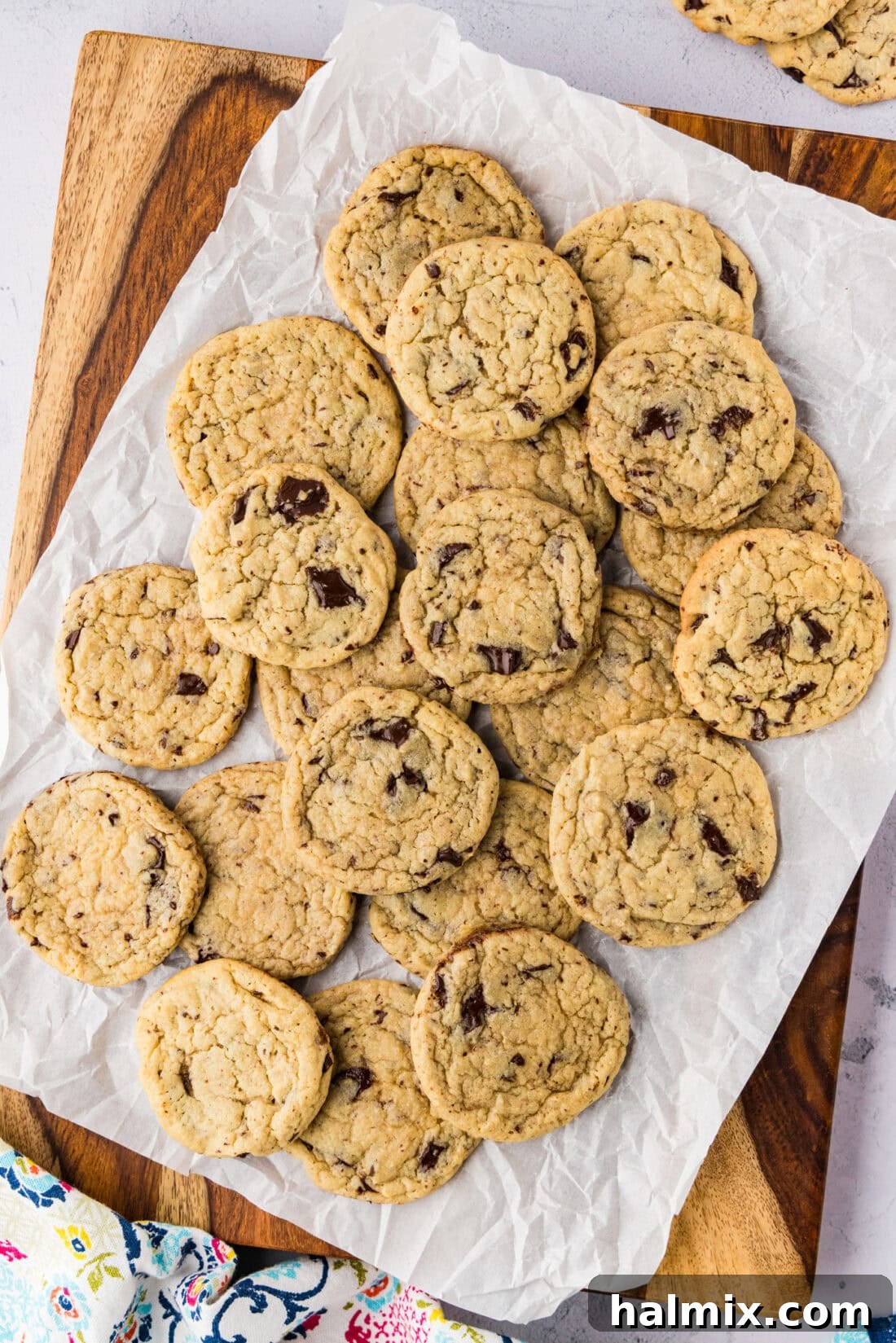 Buttermilk Chocolate Chip Cookies piled on parchment paper