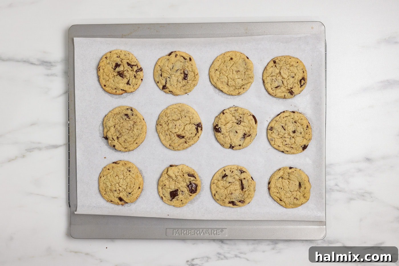Baked buttermilk chocolate chip cookies on an insulated baking sheet