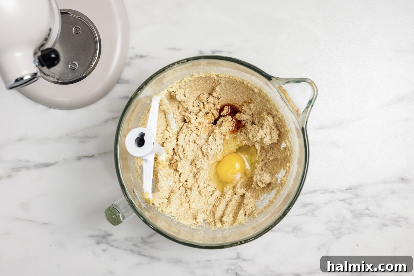 Egg and vanilla added to creamed shortening and sugar mixture