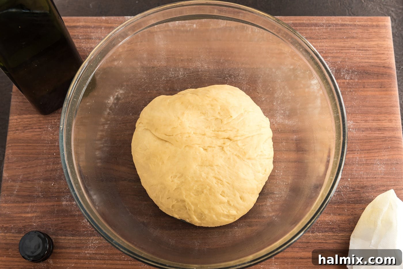 Festive German Bread 14 A smooth ball of yeast dough placed in an oiled bowl, covered for its first rise.