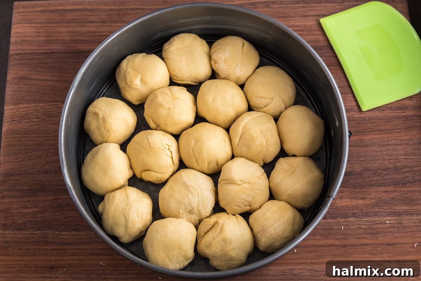 Festive German Bread 18 Dough balls arranged in a springform pan in a circular pattern, ready for their second rise.