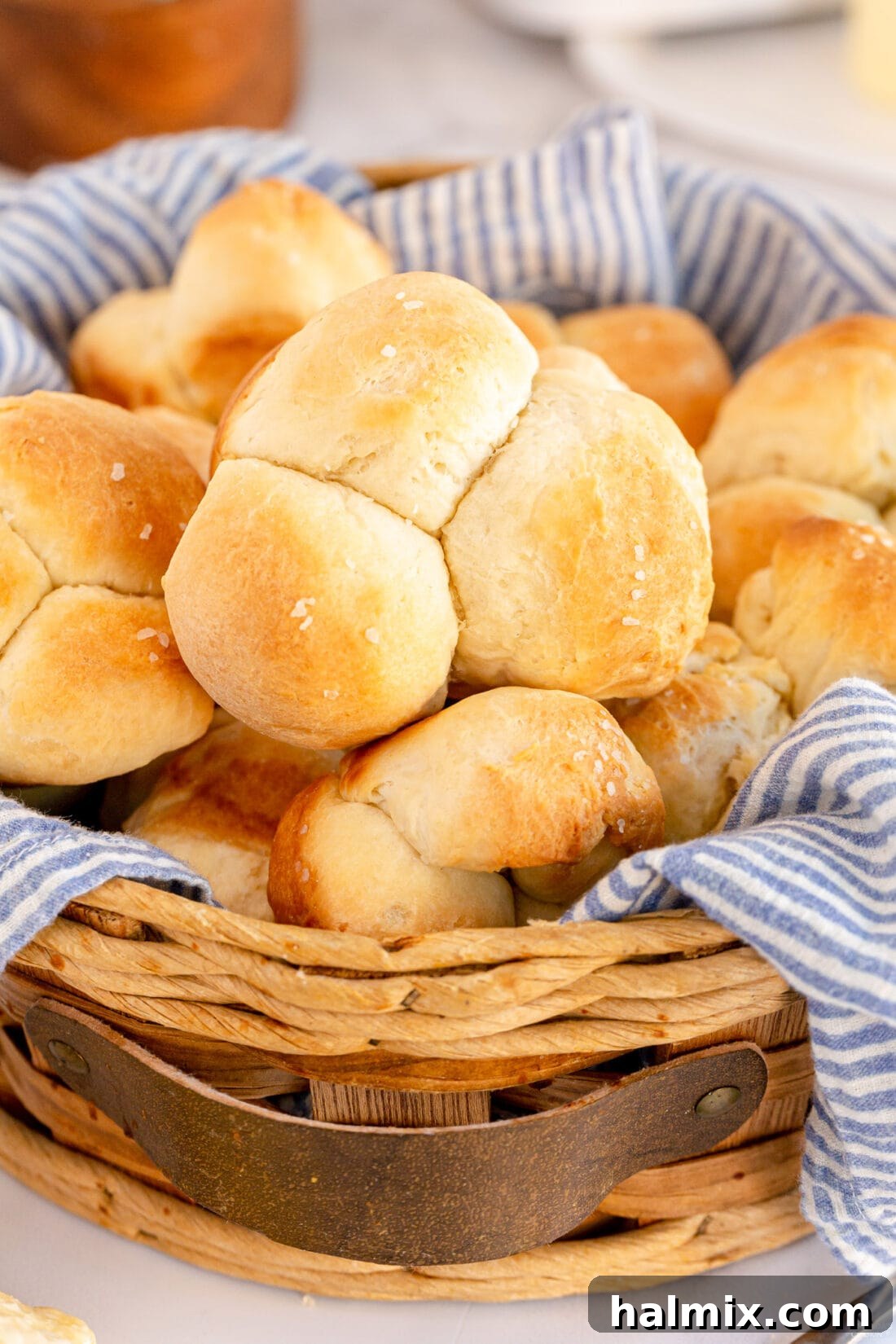 Basket of Golden Homemade Pull Apart Dinner Rolls, ready to be served.