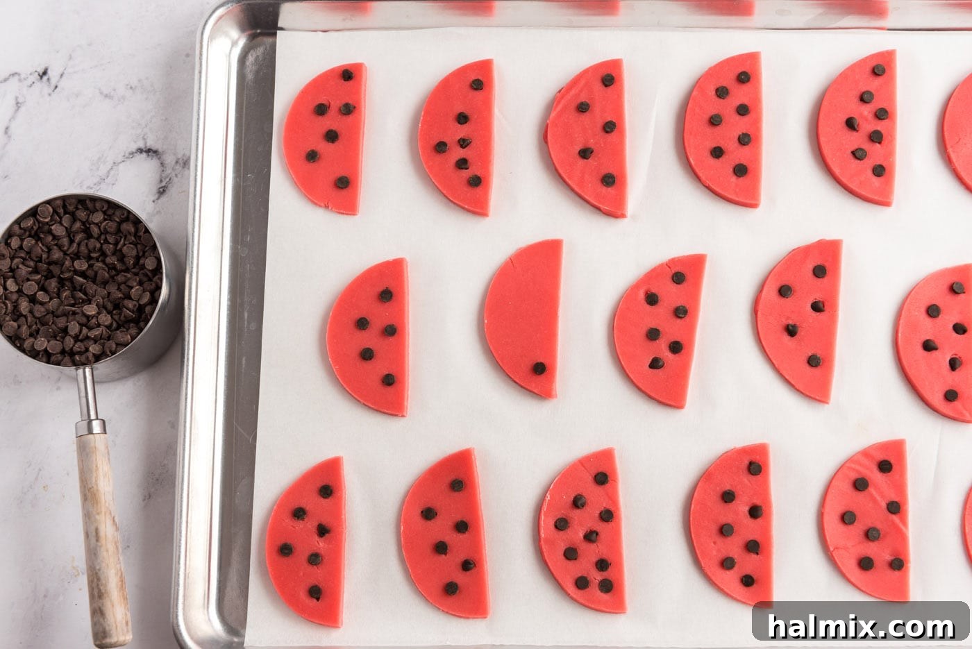 dotting watermelon cookie dough with chocolate chips