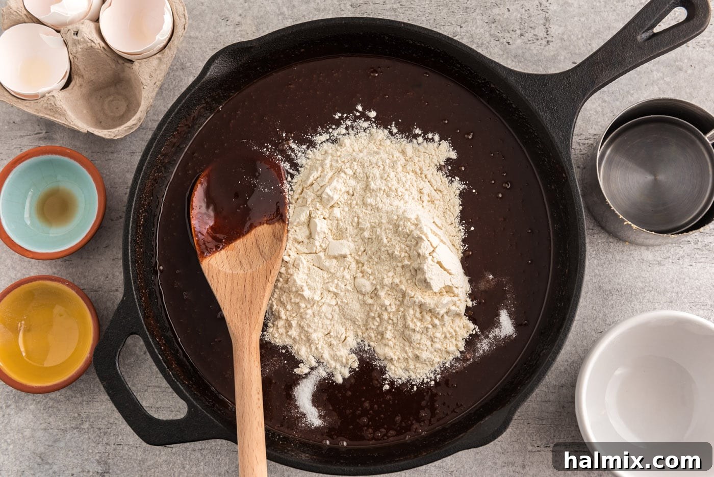 flour on top of chocolate brownie mixture in a skillet