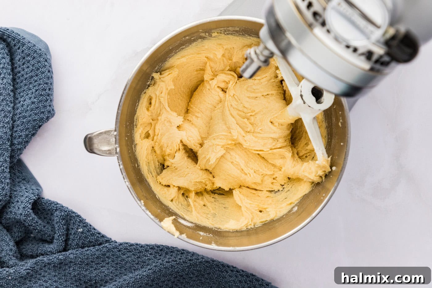 blackberry pie squares batter in a stand mixer bowl with a paddle attachment
