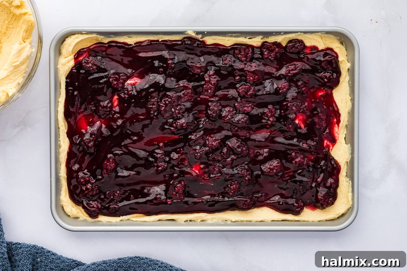 blackberry pie filling spread over cookie dough base