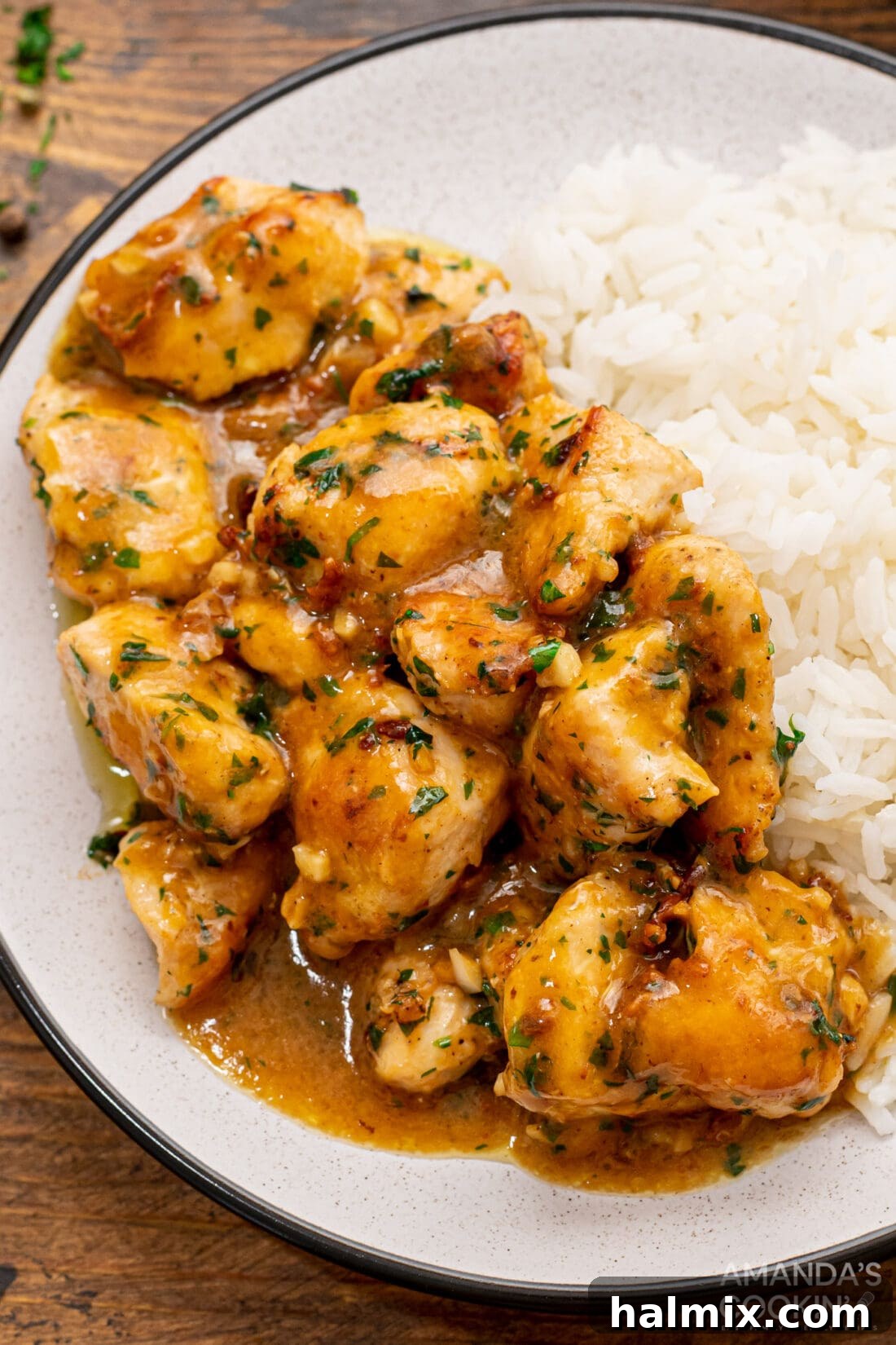 plate of garlic chicken with parsley and gravy