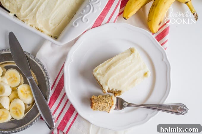 A plate of Banana cake with a fork, ready to be enjoyed