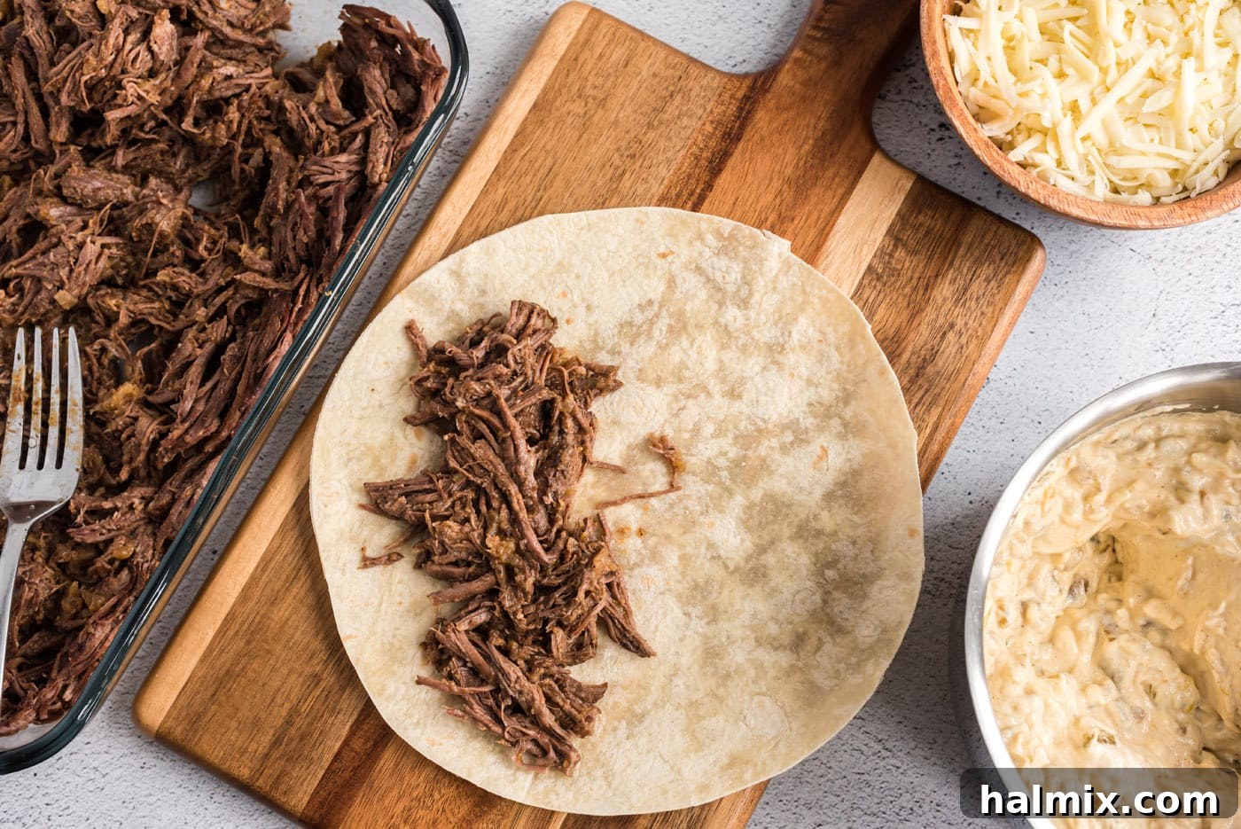 shredded beef on flour tortilla
