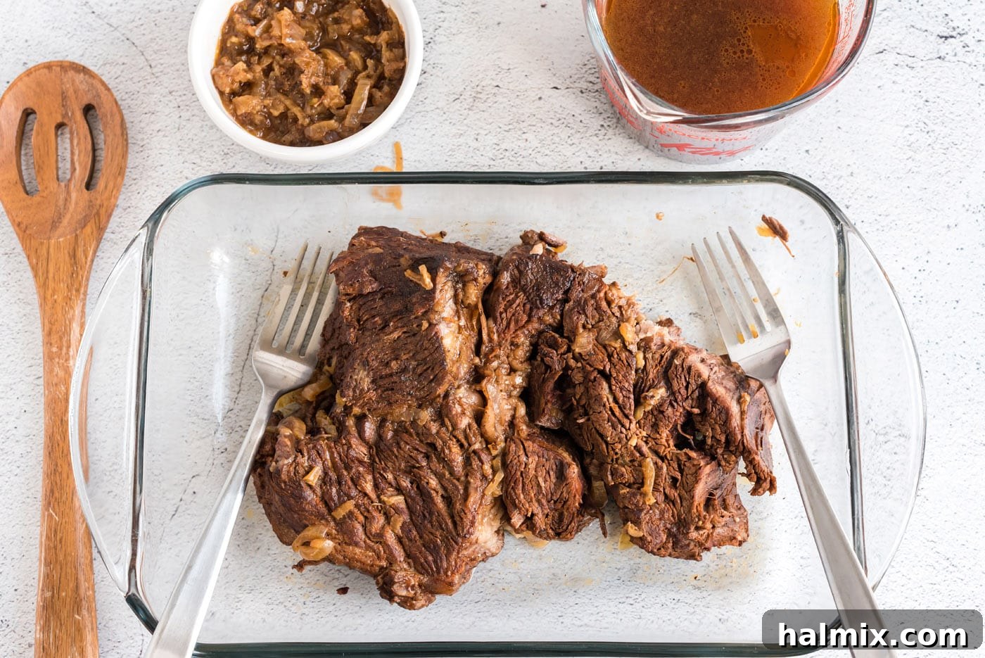 shredding beef with forks