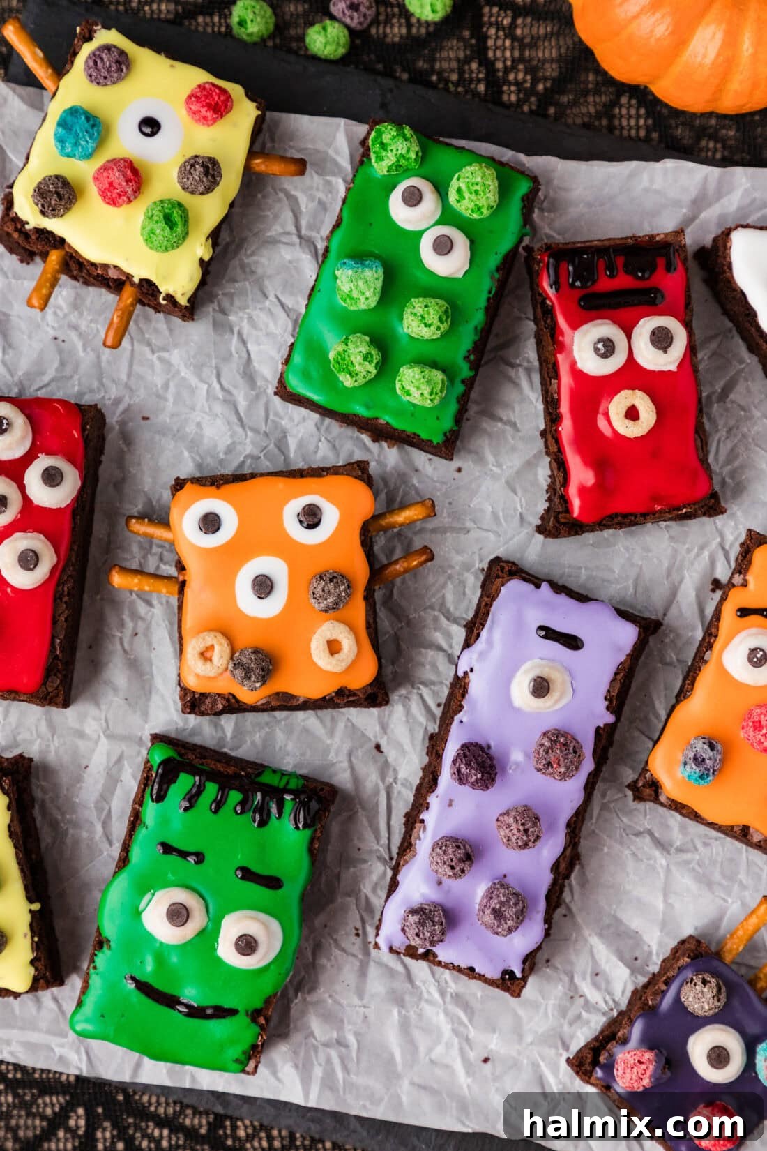 Monster Brownies on parchment paper, decorated for Halloween