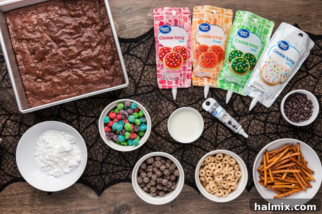 Assortment of ingredients for Monster Brownies including cereals, icing, and chocolate chips