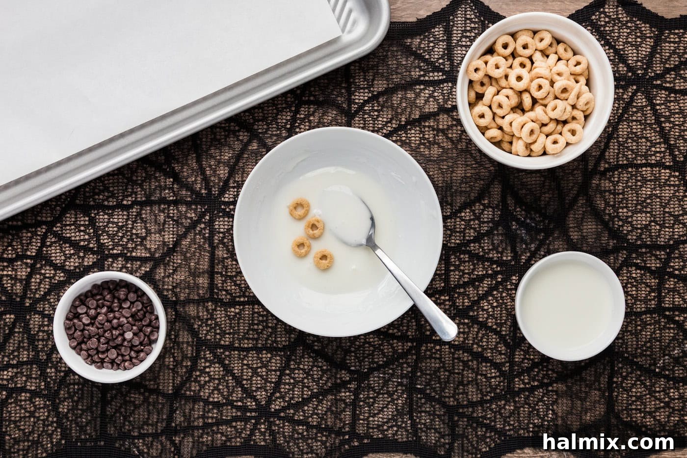 Cheerios being dipped in glaze