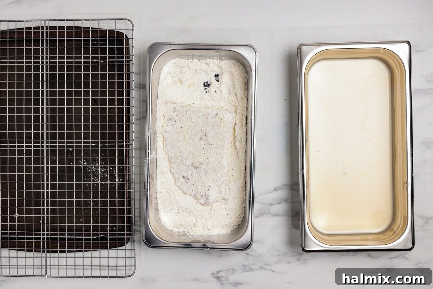 Cube steak dredged in a breading tray of flour and seasonings