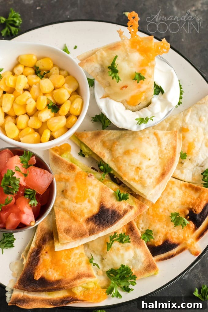 Quesados: Delicious Mexican appetizers with cheese and avocado filling, perfect for any gathering. Slices of quesados, a Mexican appetizer, arranged on a plate ready for serving with optional condiments.