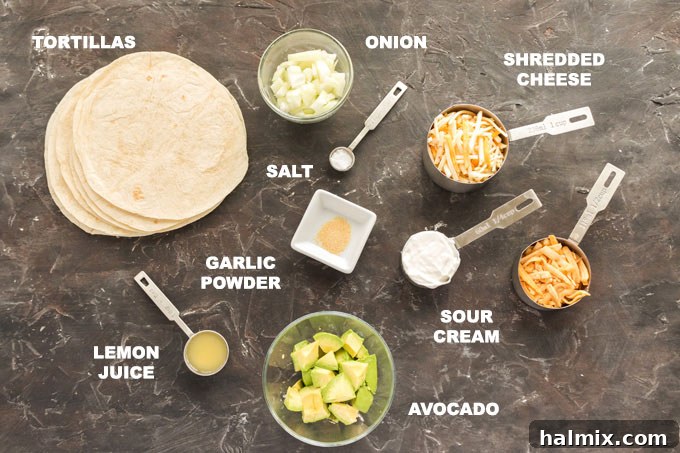 Cheesy Quesadillas: Mexico's Beloved Appetizer 2 A selection of fresh ingredients including avocados, onions, cheeses, and tortillas, laid out for making quesados.