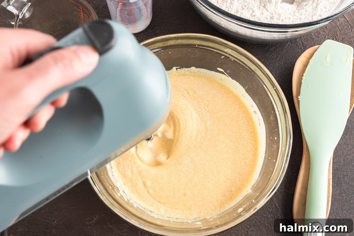 Electric mixer combining all wet ingredients for the doughnuts