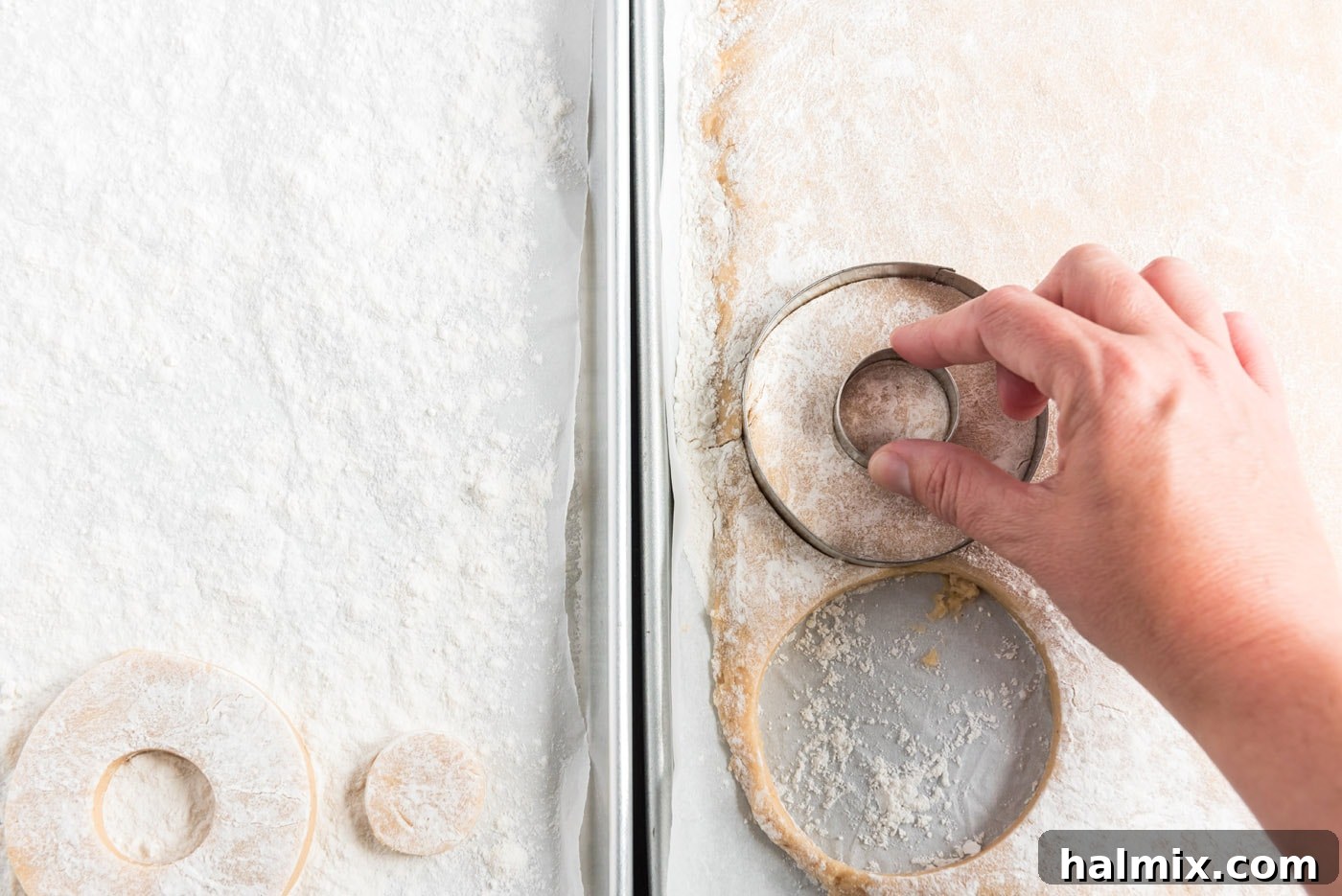 Cutting out donut shapes with a biscuit cutter from the chilled dough