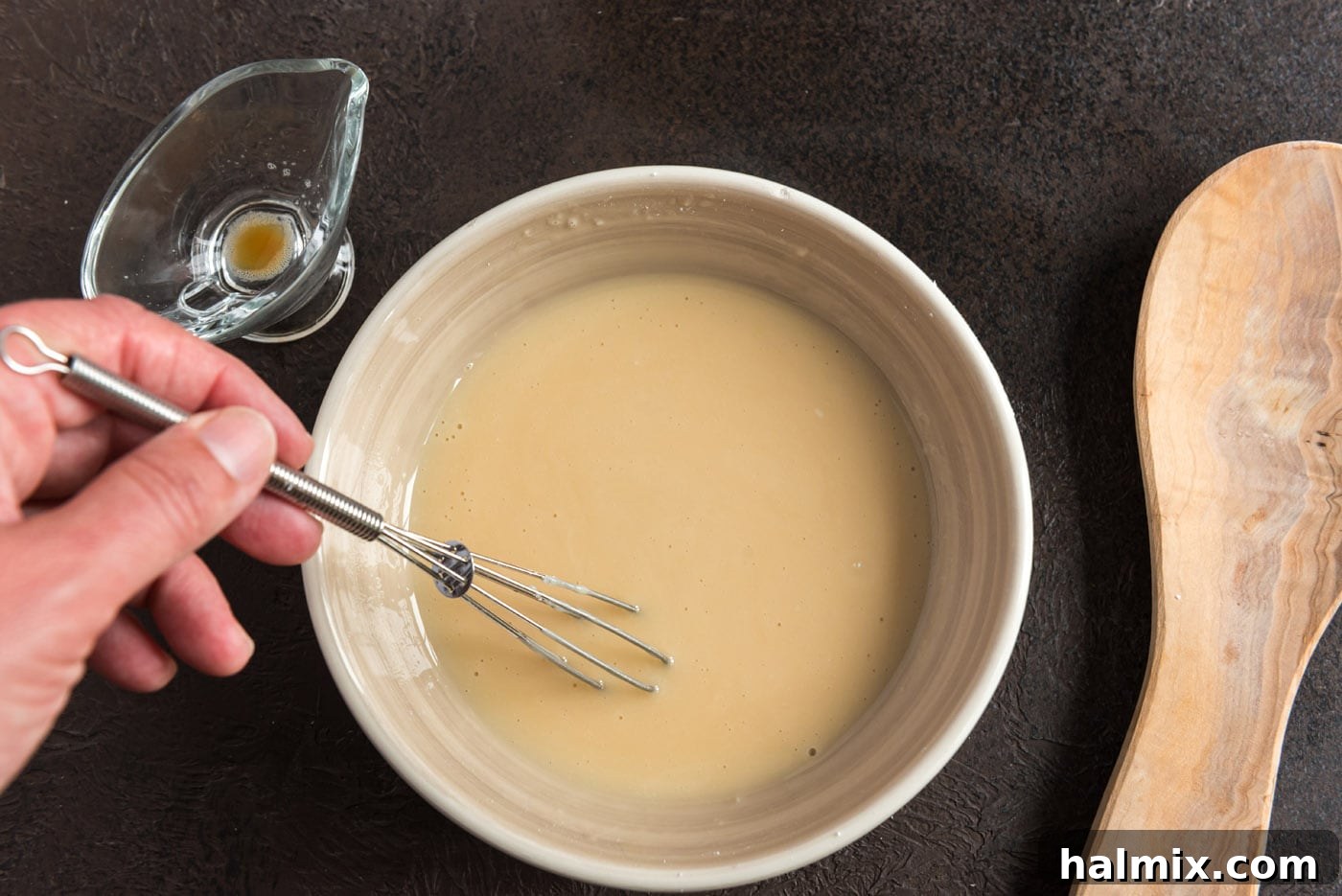 Easy apple cider glaze for donuts, showing its smooth consistency
