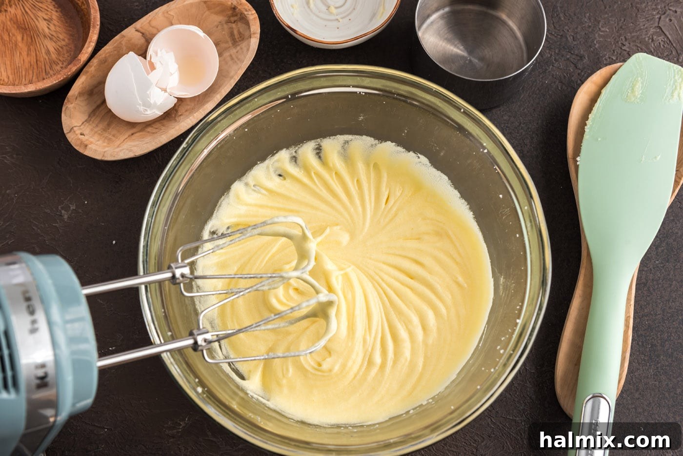 Smooth mixture of butter, eggs, and sugar in a bowl after creaming