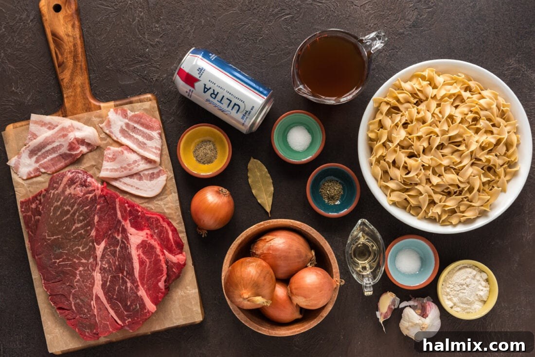 A collection of fresh ingredients laid out on a wooden surface, including cubed beef, sliced onions, bottles of beer, and various seasonings, ready for Beef Carbonnade preparation.