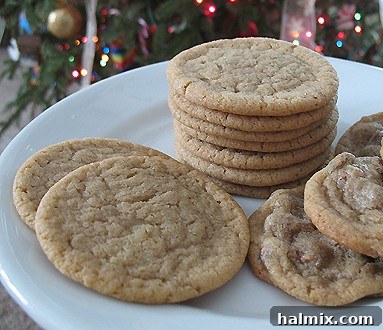 A close up photo of a plate of brown sugar cookies, showcasing their perfect round shape and golden hue.