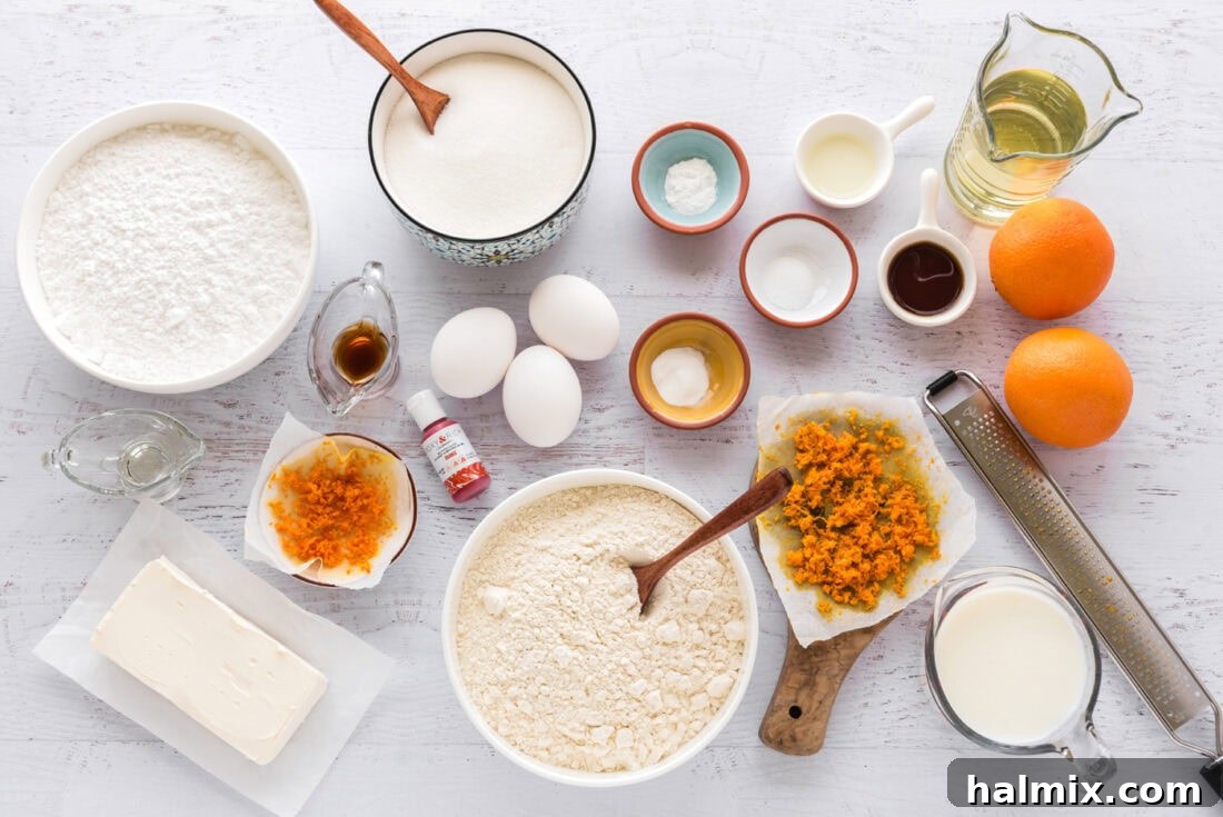 Ingredients for Orange Creamsicle Cupcakes neatly laid out on a table.