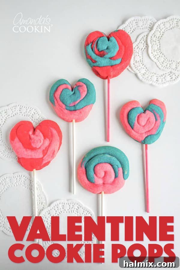These Valentine Play Dough Cookie Pops are a fun colorful treat for the kids to help make and give to their friends or teacher. #cookies #valentinesday #valentinesdaytreats #valentine #baking #dessert #kids Beautifully decorated Valentine's Day Cookie Pops, perfect for sharing