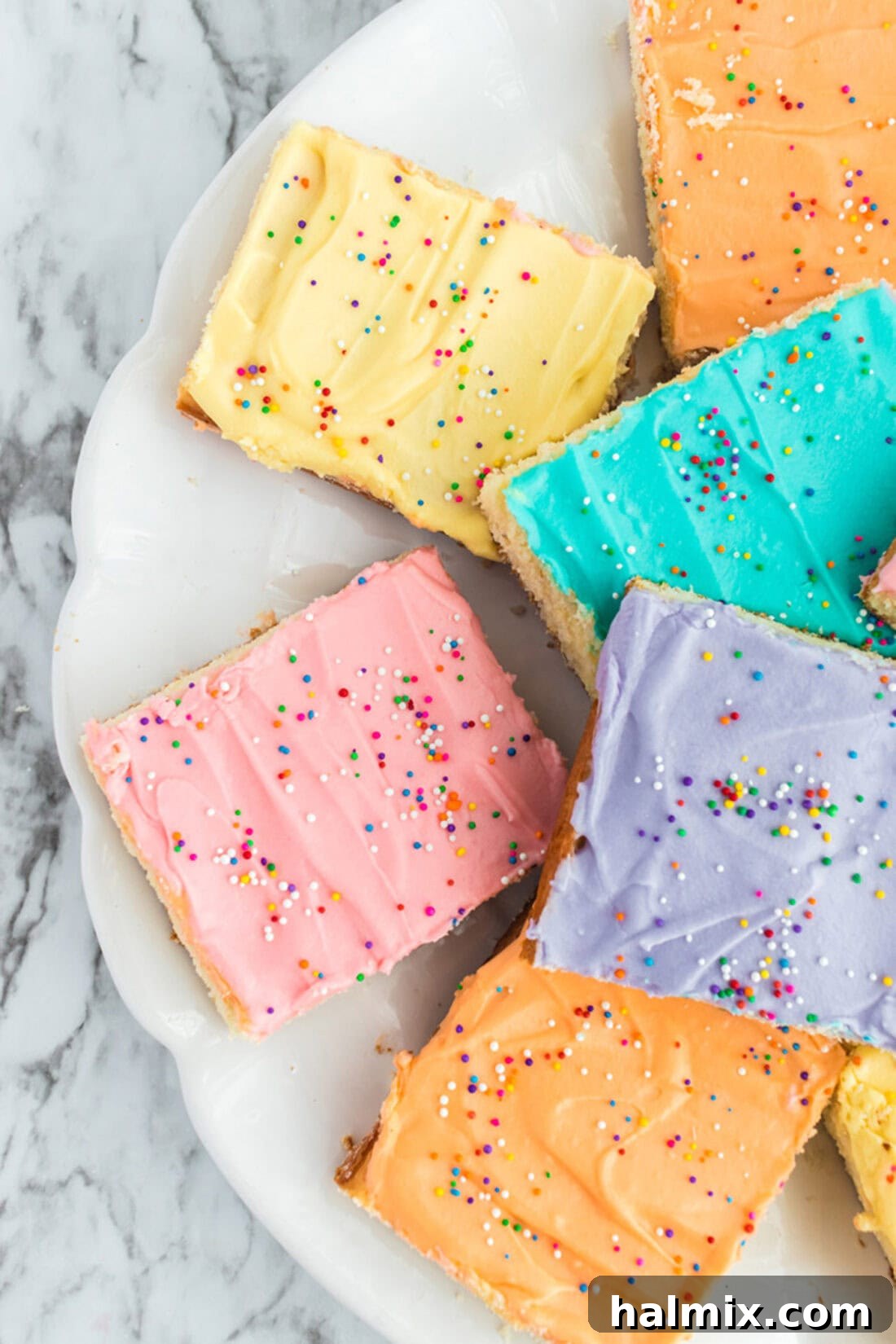 Frosted Sugar Cookie Bars: The Easiest Way to Indulge 13 Close up photo of half a plate of Frosted Sugar Cookie Bars