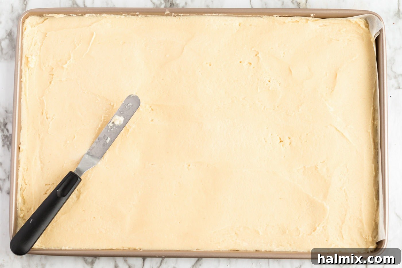 Frosted Sugar Cookie Bars: The Easiest Way to Indulge 8 Dough pressed into a jelly roll pan, ready for baking