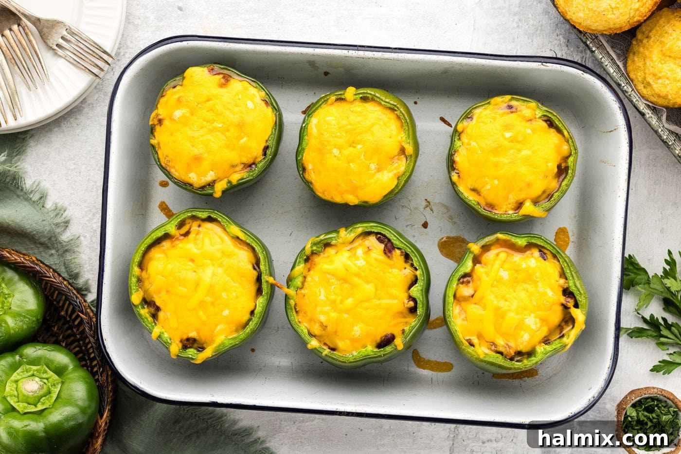 Southwest Chili Cornbread Stuffed Peppers 12 Overhead view of perfectly baked chili and cornbread stuffed peppers in a baking dish