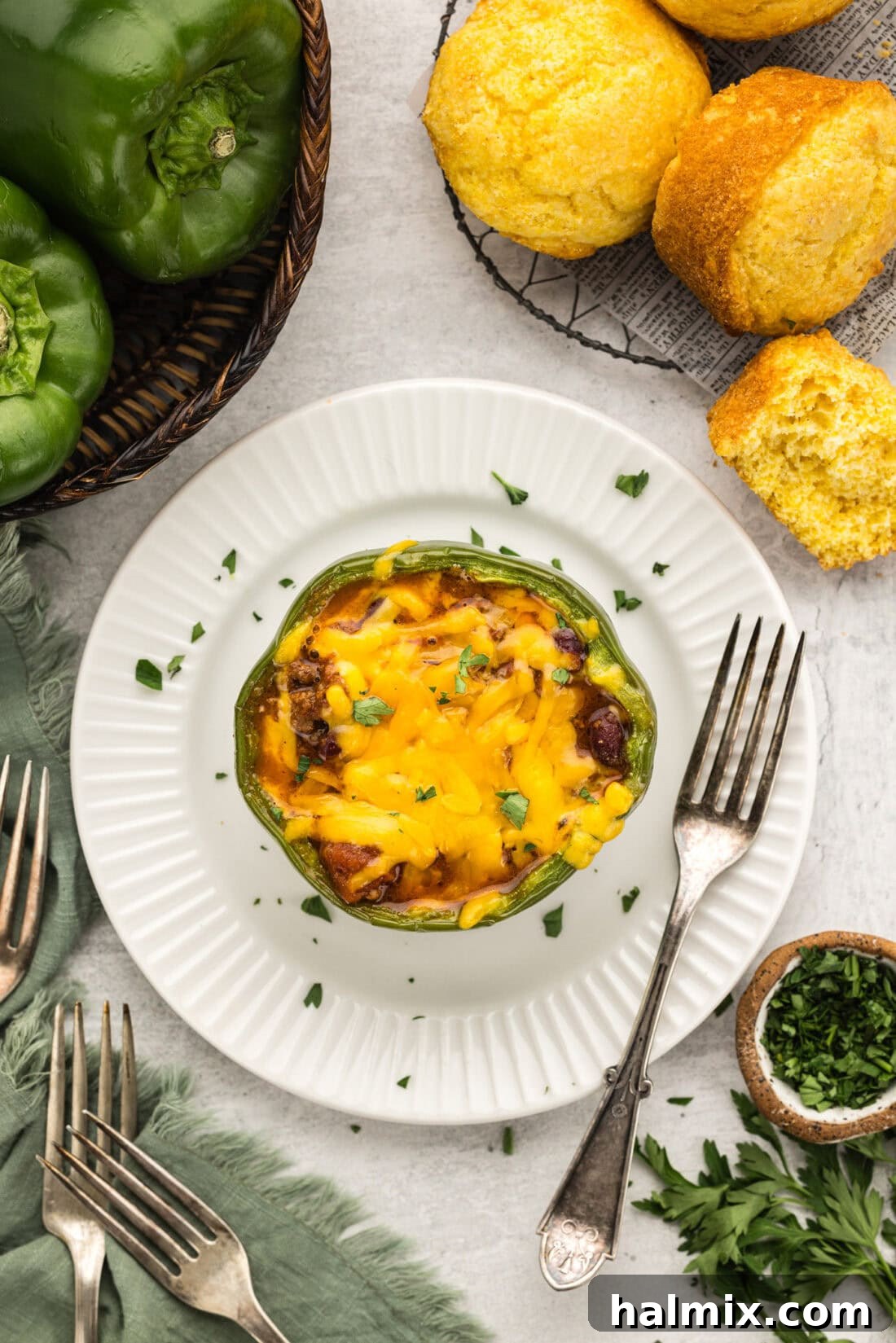 Southwest Chili Cornbread Stuffed Peppers 3 Overhead shot of a delicious Chili and Cornbread Stuffed Pepper on a plate, ready to be enjoyed