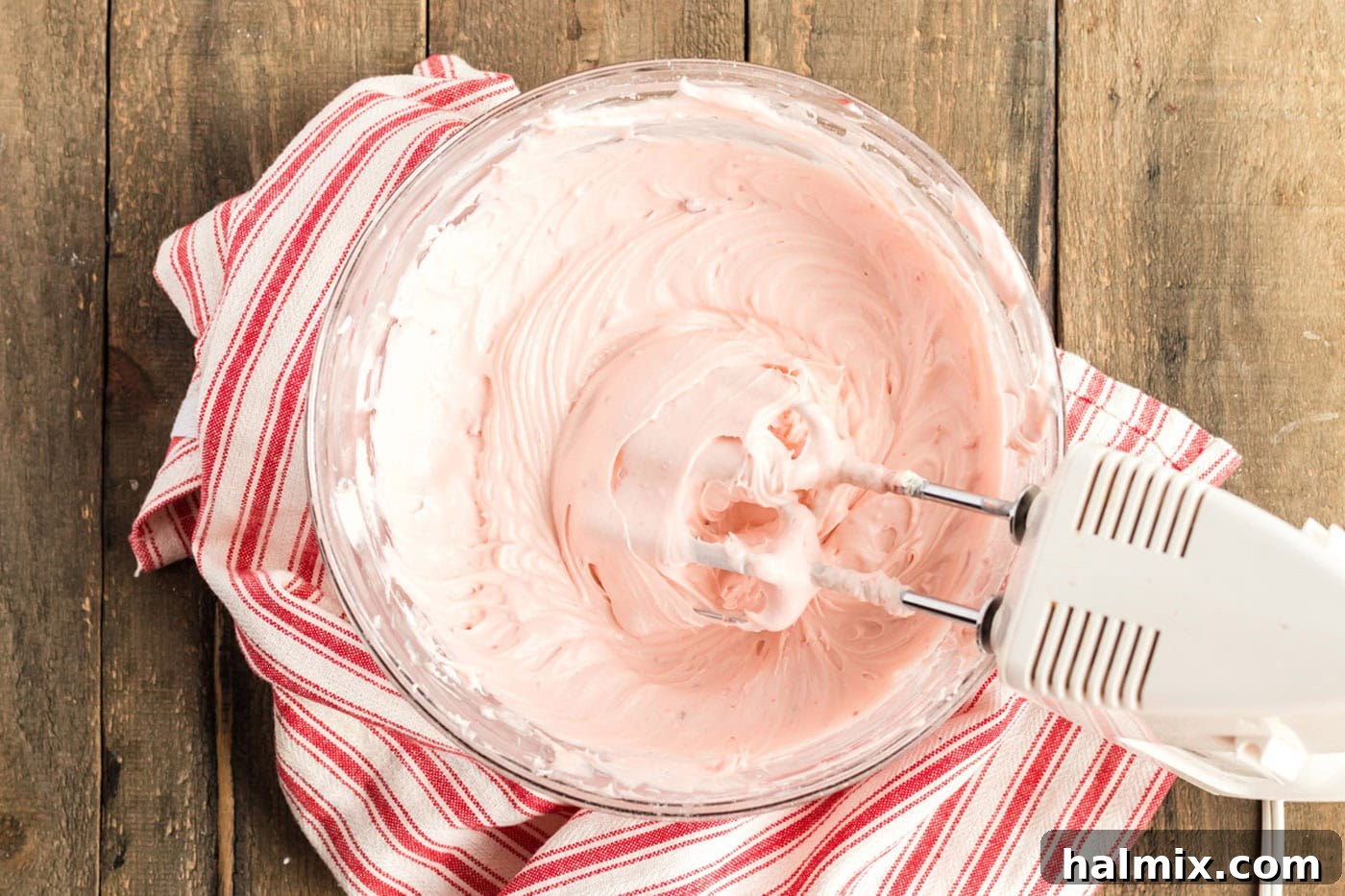cherry frosting in a mixer bowl