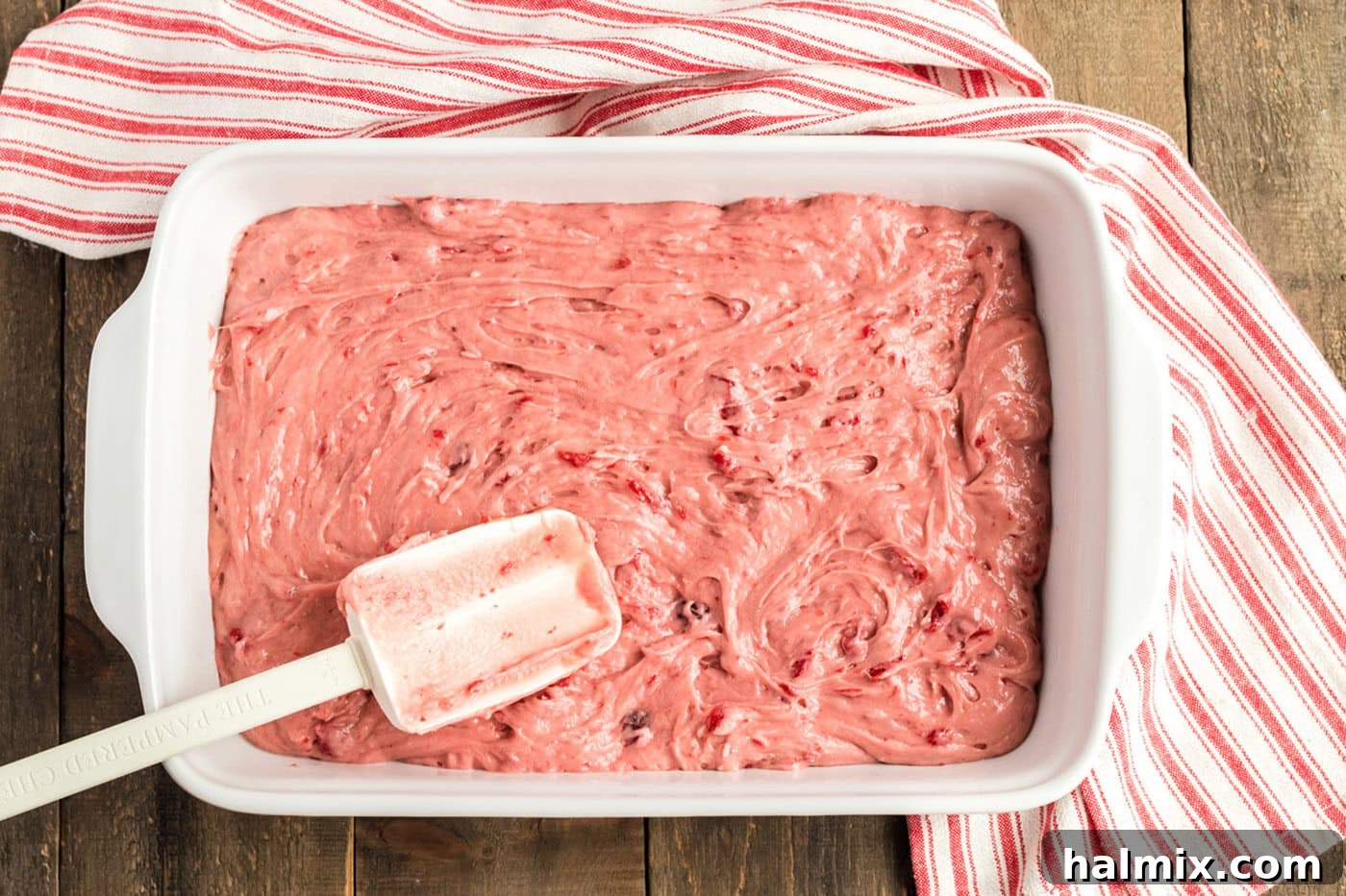 cherry cake batter in a 13x9 pan