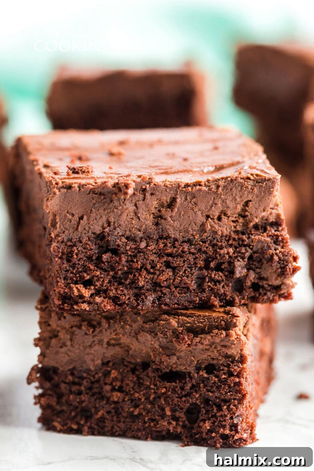 The Ultimate Chocolate Cheesecake Brownies: Rich, Decadent, and Irresistible Two Chocolate Cheesecake Brownies stacked on top of each other, showcasing the distinct layers