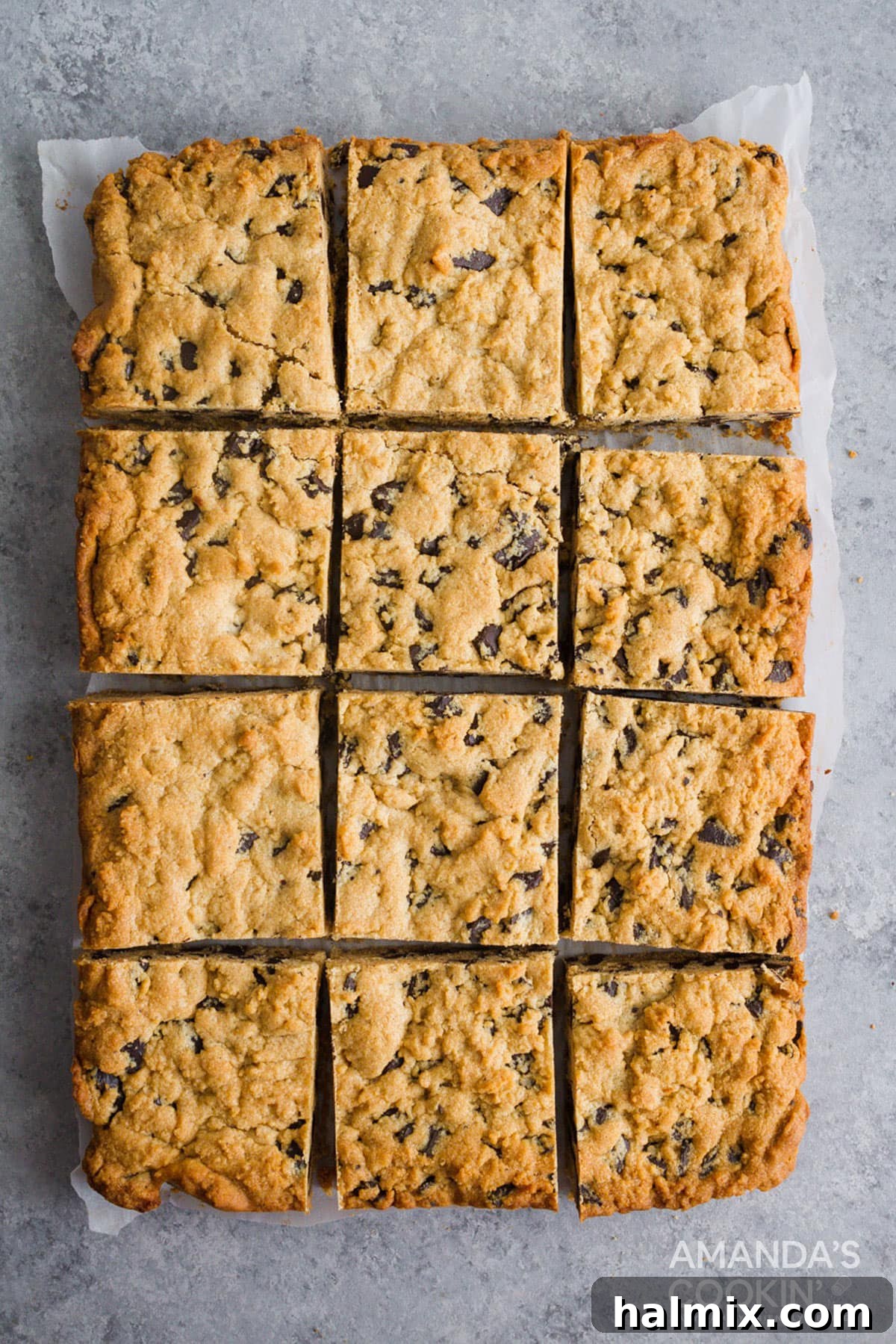overhead view of peanut butter chocolate chunk bars on parchment paper
