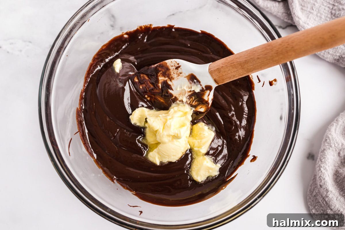making chocolate ganache with hot cream, chocolate, and butter