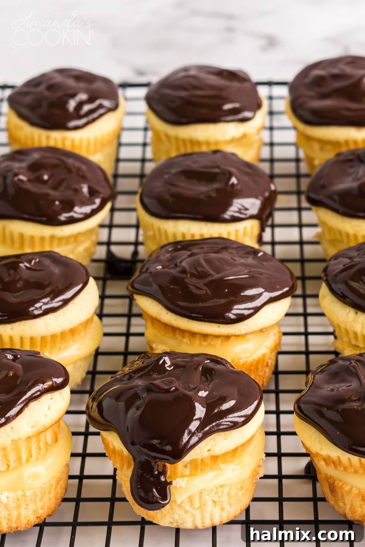 wire rack full of cupcakes